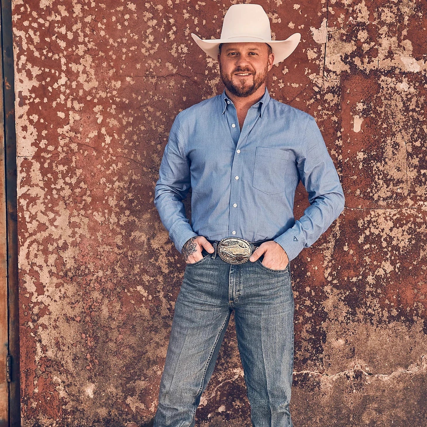 Men's western boots with a scalloped edge and a pull - on strapWrangler Men's Cody Johnson L/S Diamond Button Down Shirt in Blue